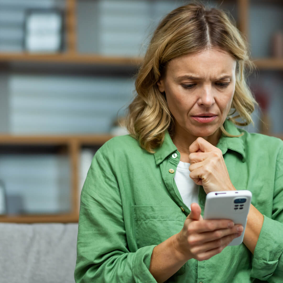 Older person speaking with a family member by phone